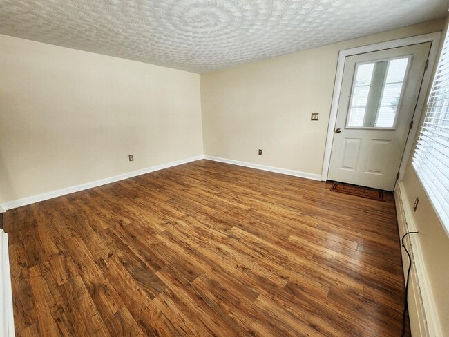Large living room with new flooring - 216 5th St Unit 1