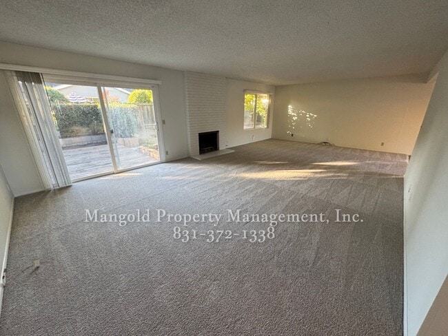 Photo - Beautiful 4-bed 2-bath Home with Cozy Fireplace and Large Backyard!