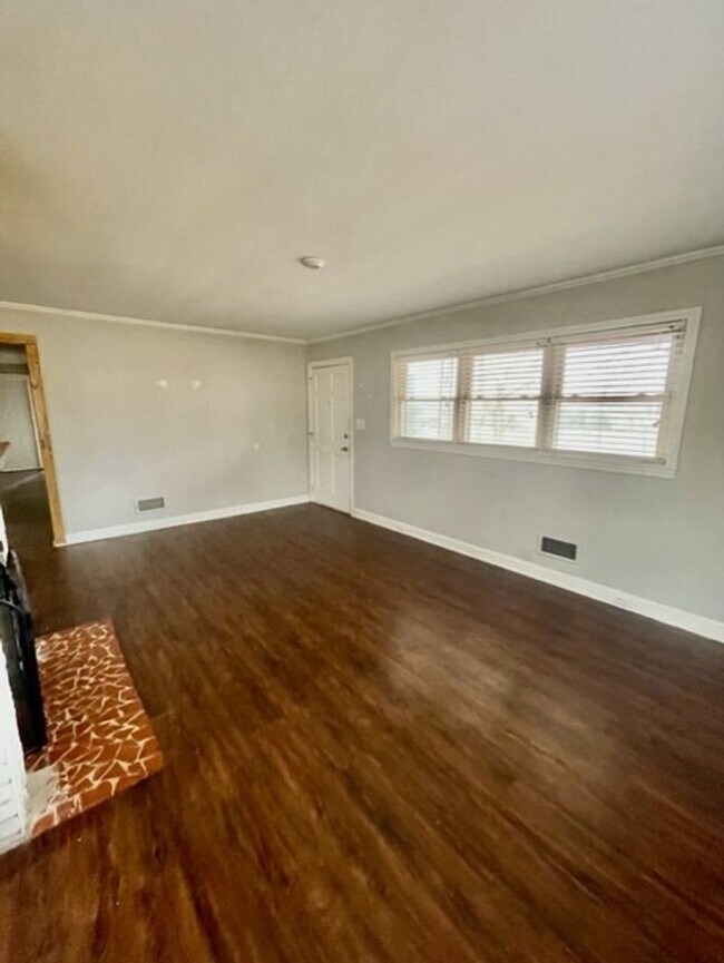 Photo - Adorable 3-bed 2-bath brick ranch, sitting on nearly a half acre lot, is located in Gastonia