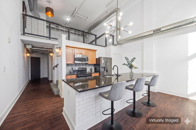 Urban Loft Condo Featuring Stunning Views & Rooftop Entertaining