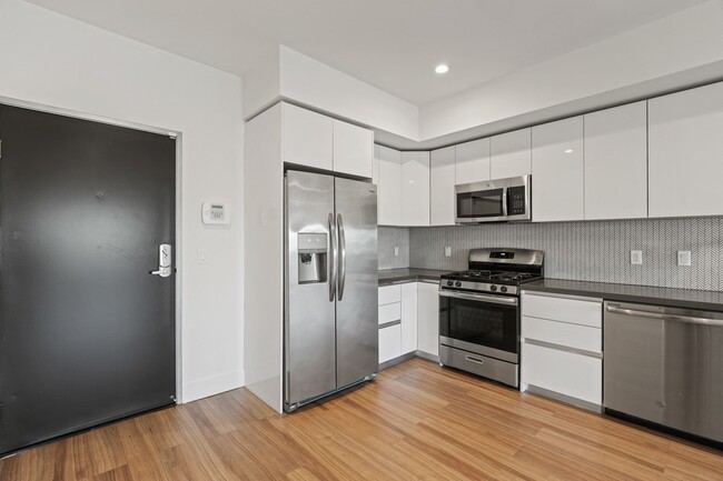 Front Entry of Apartment and Kitchen
