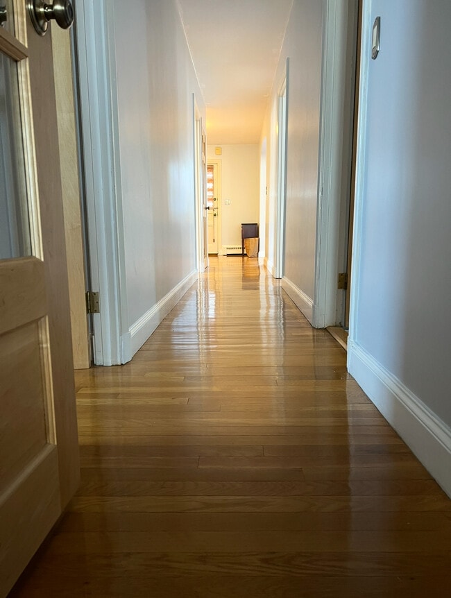 Gleaming hardwood floors. - 202 Orient Ave Unit 2