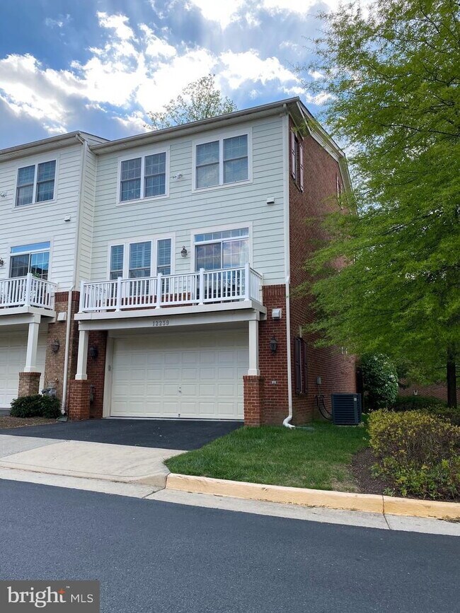 Bright & Spacious End-Unit Townhouse with Two-Car Garage!