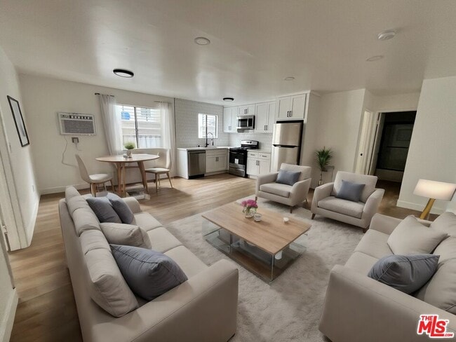 Building Photo - 5440 Carlton Way Unit 105