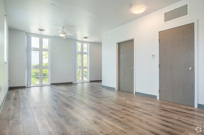 3BR, 2BA - 1,250SF - Living Room - Amphora Apartments