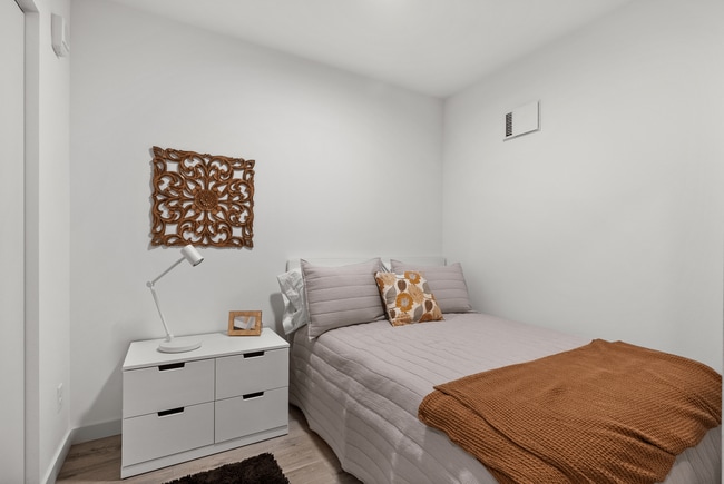 Comfortable secondary bedroom with a clean, modern design.