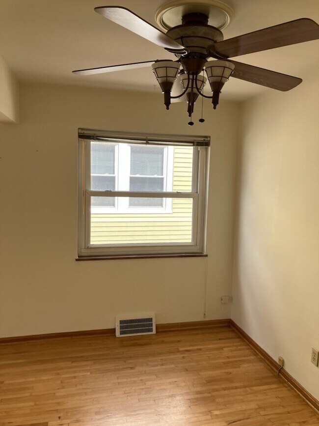 Dining room looking east with ceiling fan - 17003 Hilliard Rd