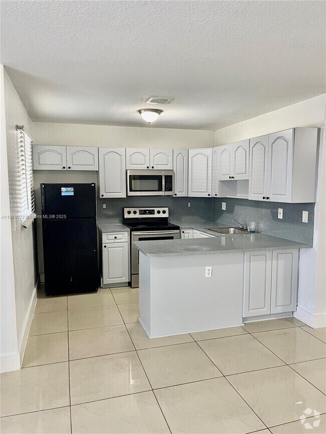 Building Photo - 5857 NW 13th Ave Unit 5857 Rental