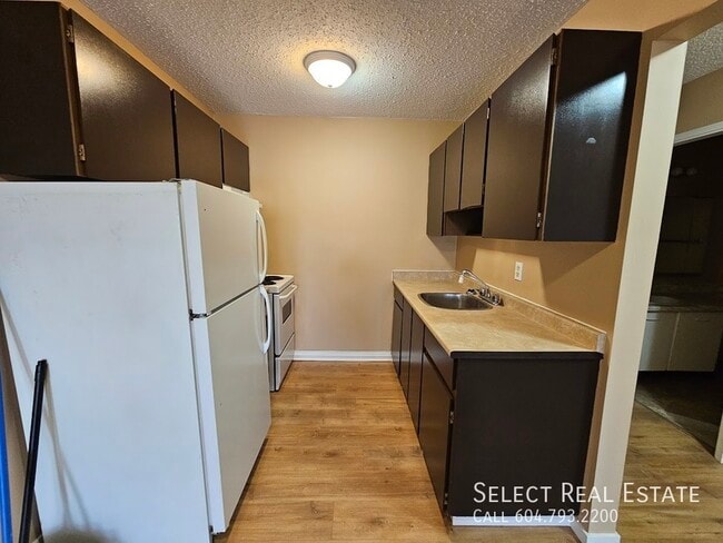 Building Photo - 33924 George Ferguson Way Unit 305