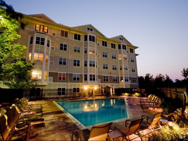 Exterior View of Pool and Apartments at Night - Canton Woods Rental