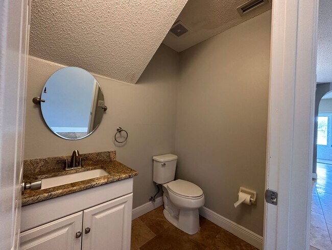 Photo - Beautiful Townhome in a gated community with assigned parking spots and a community pool