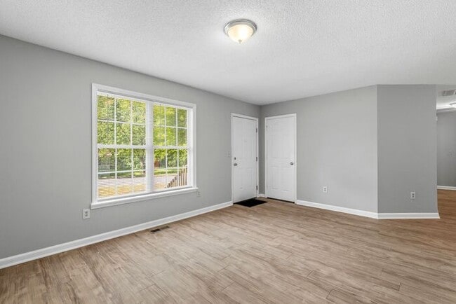 Photo - NW Home - Updated Kitchen and Bathrooms, Wood Laminate Flooring, Deck, Must See!