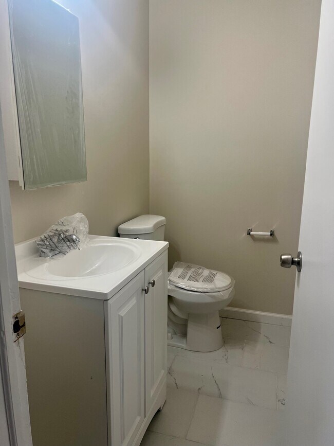 Half bathroom on the 1st fl. - Warner Village Rental Community