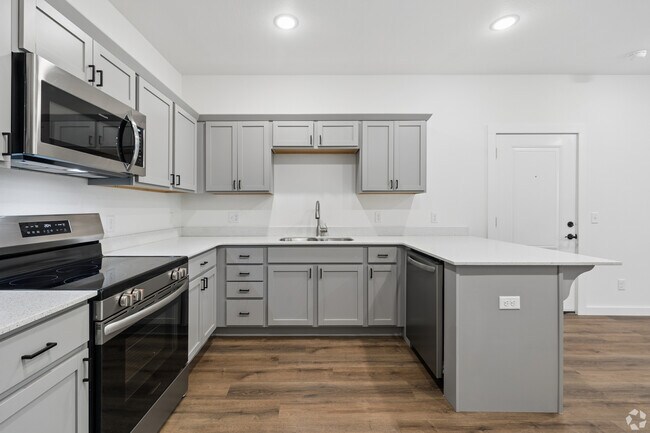 Kitchen with gray shaker cabinets