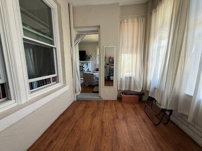 Photo - Rogers Park 2 Bed 1 Bath With Central AC & Heat, Beautiful Sunroom, Dog Friendly, Available July ... Unit 2