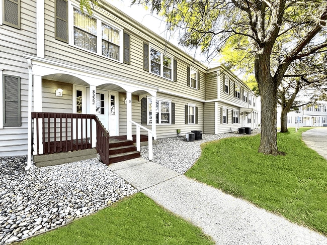 Charming Exterior with Louvered Shutters - Rolling Pines Apartments