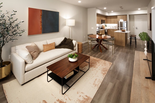 Design Collection II Kitchen with oak cabinetry and living and dining areas with hard surface flooring