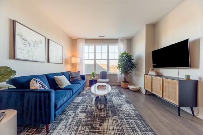 Living Room with Large Windows at The Heights at Glen Mills in Glen Mills, PA 19342 - Heights at Glen Mills Apartments