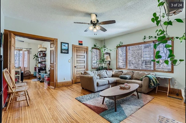 Living room and entrance to bed room 3. Tons of natural light in both areas.