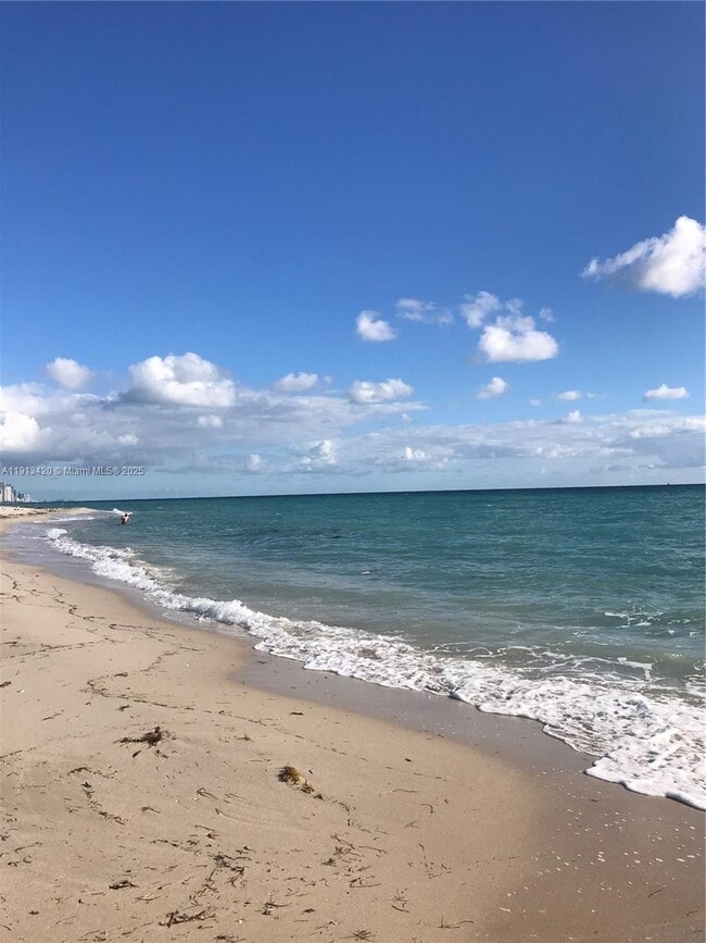 Building Photo - 8233 Harding Ave Unit 305