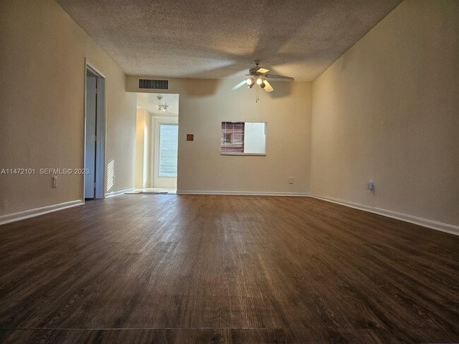 Building Photo - 5940 NW 64th Ave Unit 106