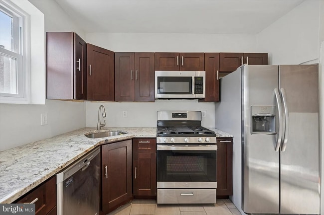 Photo - Modern 3-Bedroom Rowhome with Backyard Pat...