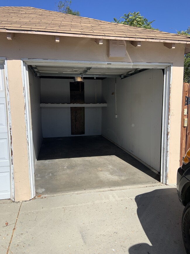 One covered Garage + driveway parking - 1025 Locust St Apartments Unit 1025