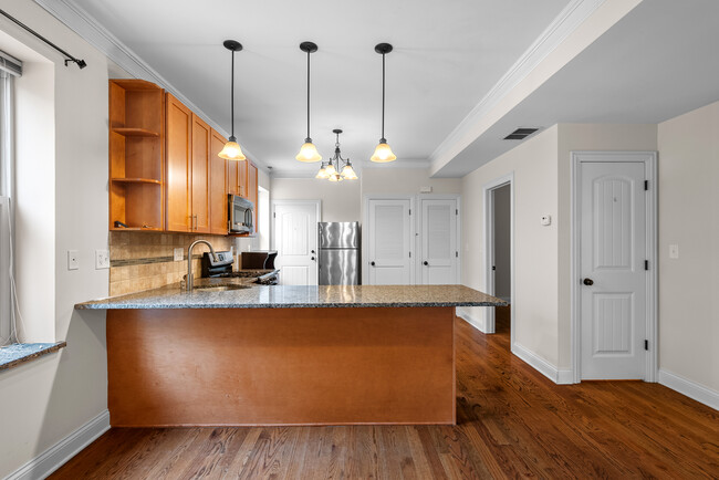 Kitchen with counter seating - 2117 W Irving Park Rd Apartments Unit 2F