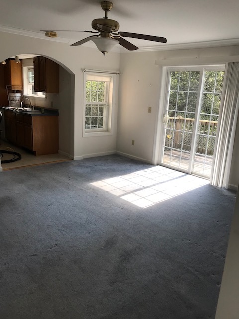 livingroom with private deck - 400 N Stark Hwy Unit Apt. A