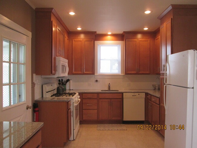 Subway tile backsplash, granite countertop, Kraft maid soft closing cabinetry