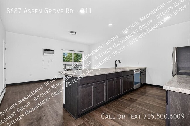 Building Photo - 8687 Aspen Ln Unit 311