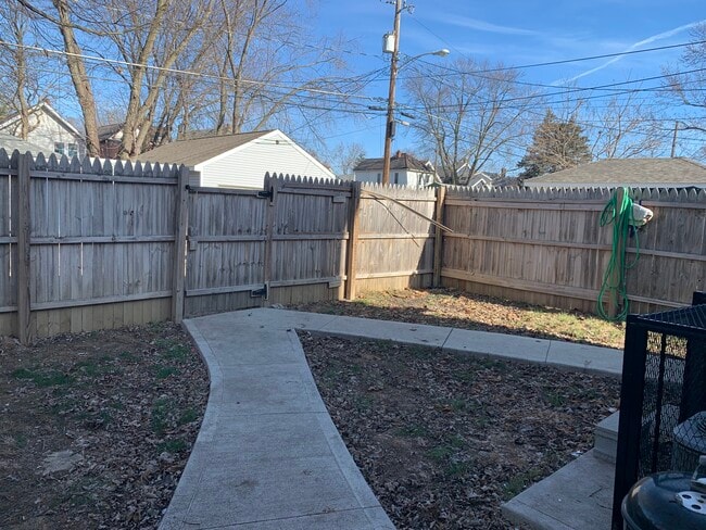 6’ fenced backyard. Car parking behind fence - 672 Stewart Ave Unit 672 Stewart Ave