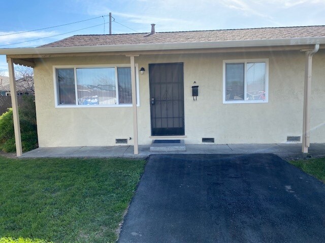 Door front assigned parking pad - 1645 Kidder Ave Apartment Unit 45