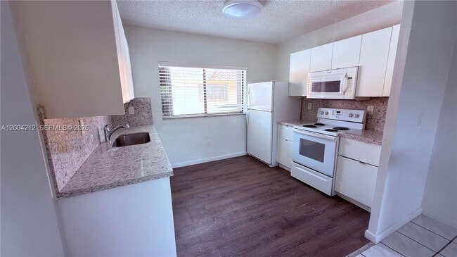 Building Photo - 6370 W 27th Ct Unit 203