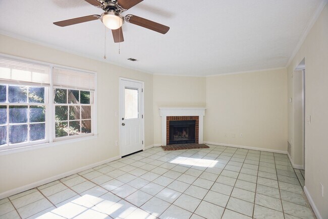 Photo - 2BR/2.5BA Townhome Gem with Fenced Yard, Fireplace & Bay Windows