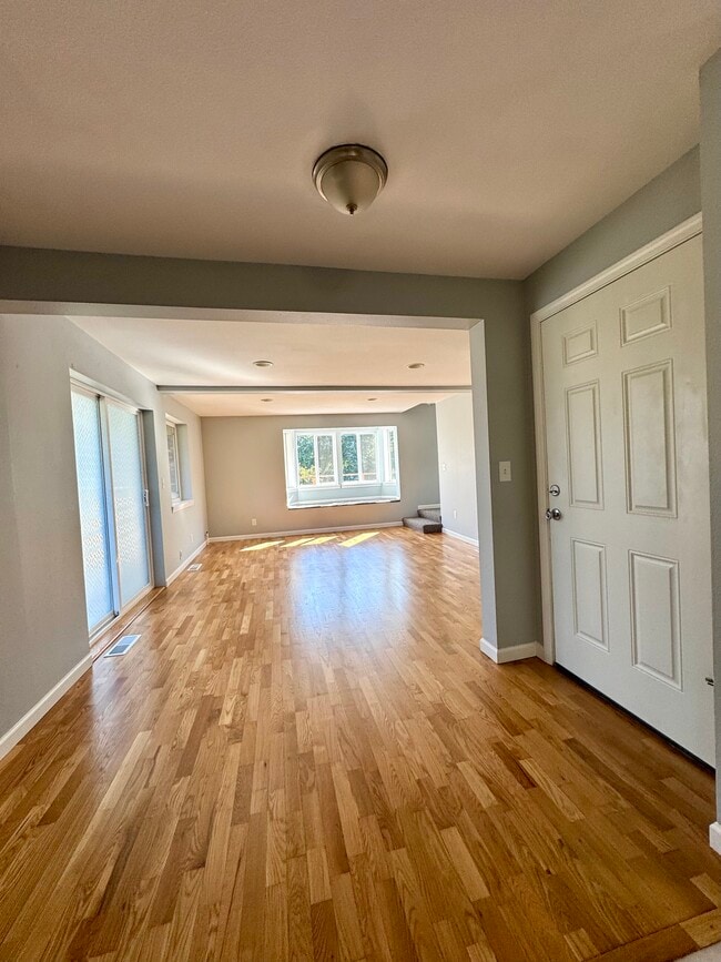 Front door to the unit is on the right. View of the dining room and living room from the kitchen.