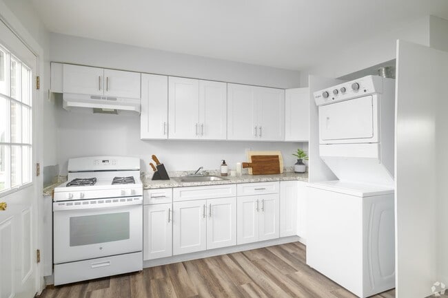 Discover modern living in a sleek, fully-equipped kitchen featuring contemporary appliances and ample storage. Experience the perfect blend of style and functionality. Elevate your lifestyle today—schedule a tour now! - Pinewood Apartments