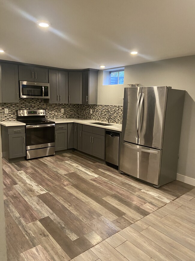 Kitchen- stainless steel appliances, electric range, garbage disposal - 3901 N Kiska St Unit B