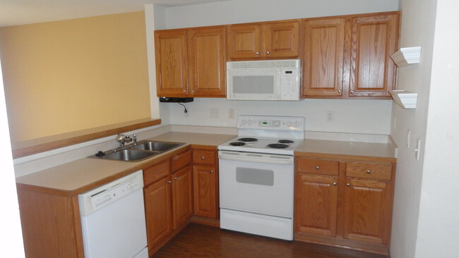 Kitchen, dining room opens to private patio. - 23153 Iris Avenue Townhome