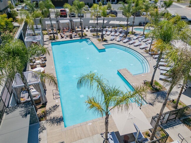 Luxurious Outdoor Pool with Cabanas and Sun Loungers