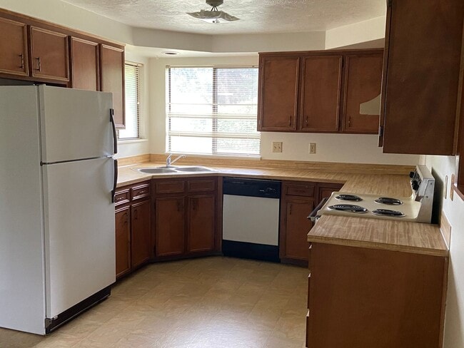Photo - New Paint & Flooring.  Large yard and over...