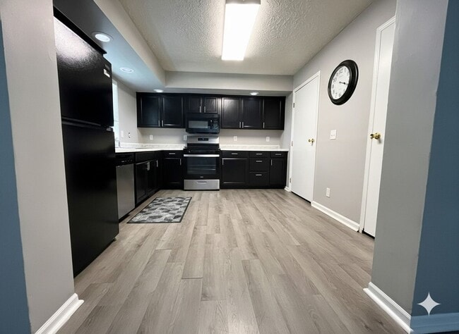 Photo - Move-In Ready 4 Bed, 2 Bath with 1-Car Garage and Updated Kitchen