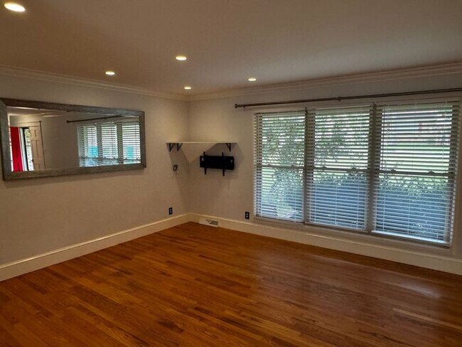 Photo - Fenced yard, huge deck, and FIVE BEDROOMS