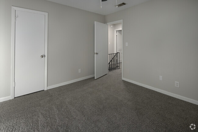 2BR - 1.5BA Primary Bedroom with view to upstairs landing
