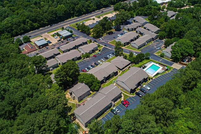 Surrounded by trees along University Drive