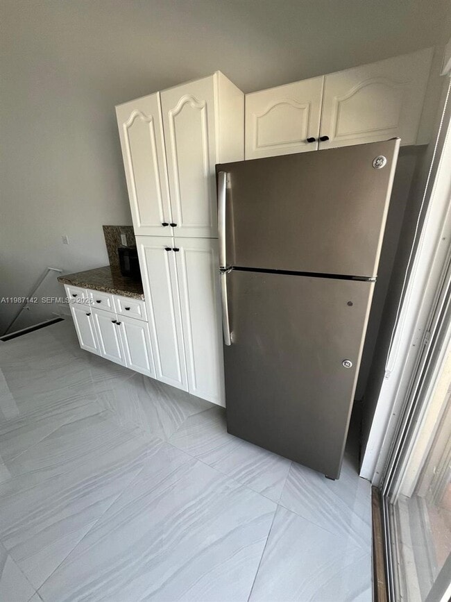 Building Photo - 7526 W 20th Ave Unit 203