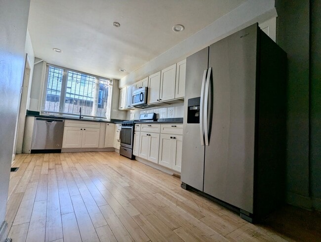 Photo - Your New Home In Point Breeze - 3br/1.5ba with wood flooring, granite counter tops, steel applian...