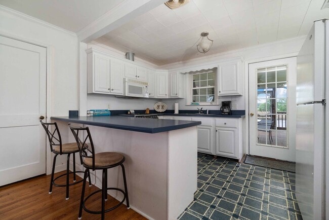 Photo - Waterfront, furnished home with a boat dock