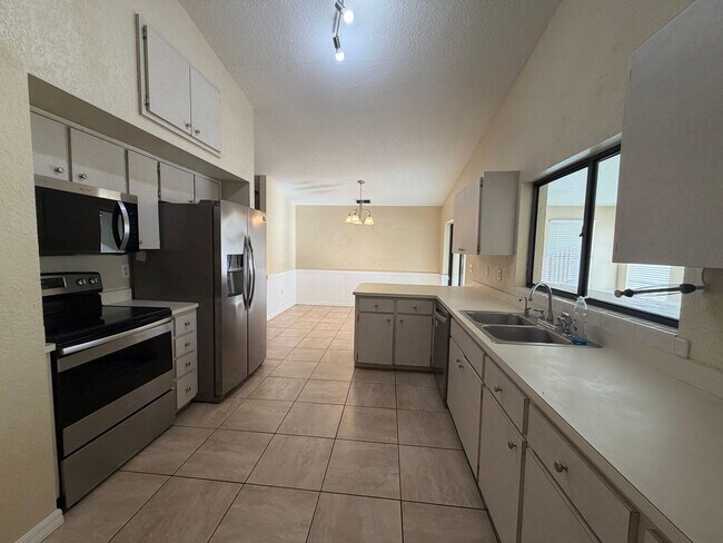 Photo - Spacious Open-Concept Home with Bonus Patio & Fenced Yard