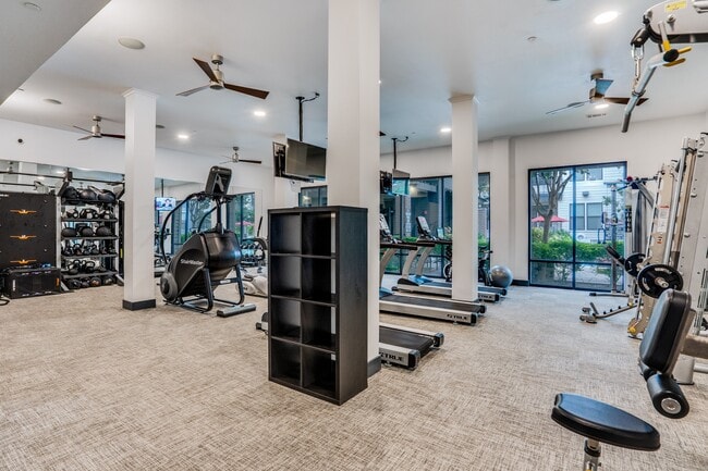 fitness center with cardio and weight equipment